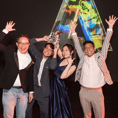 An advocate celebrating with friends after an awards ceremony