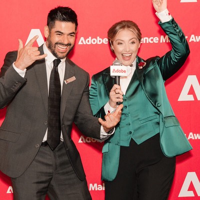 Two hosts having fun on the Experience Maker Awards red carpet