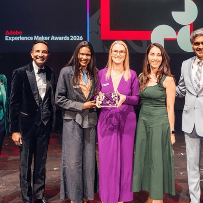 A group of Experience Maker Award winners posing on stage